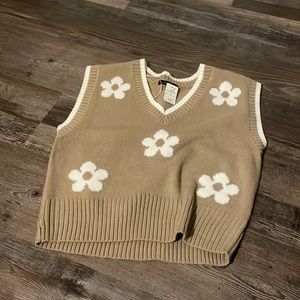 size large but can vary depending on desired fit. NWT boutique sweater vest